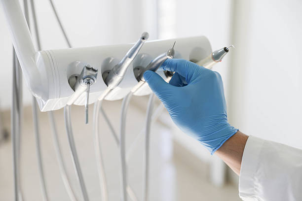 Professional Tooth Extraction technician working in Auburn, IL
